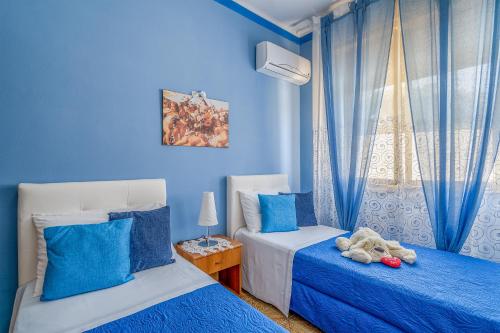 Giường trong phòng chung tại La casa Blu