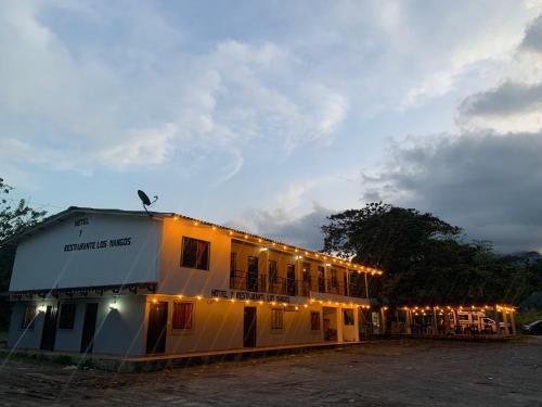 a building with lights on the side of it at Hotel Los Mangos in San Luis