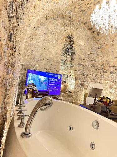 LIVING IN A CAVE UNDER ACROPOLIS