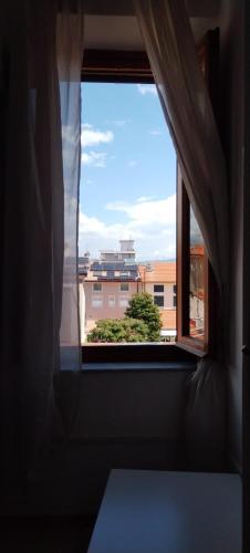 a window with a view of a building at Hotel Canarco in Viareggio