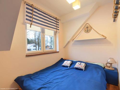 Ένα ή περισσότερα κρεβάτια σε δωμάτιο στο Apartament Kamyczek