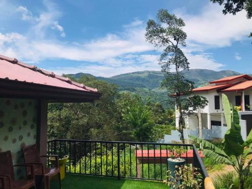 a balcony with a view of the mountains at Moon villa in Kandy