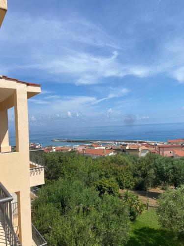 a view of the ocean from a house at Hotel America in Marina di Camerota