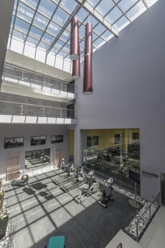 a rendering of a gymnasium with several exercise equipment at Vila Gale Evora in Évora