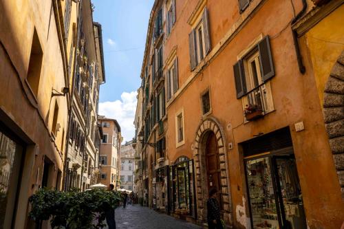 an alley in a city with buildings at Home at Rome Luxury Navona in Rome