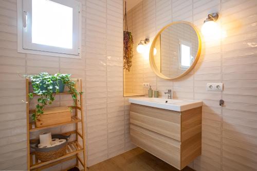 a bathroom with a sink and a mirror at Casa Can Ferran in Nuestra Señora de Jesus