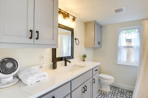 a white bathroom with a sink and a toilet at Frisco Vacation Rental in Rail District with Hot Tub in Frisco