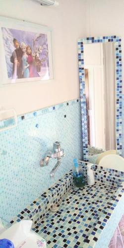 a bathroom with a blue and white tiled floor at Minpaku Ota - Vacation STAY 11962 in Otaru