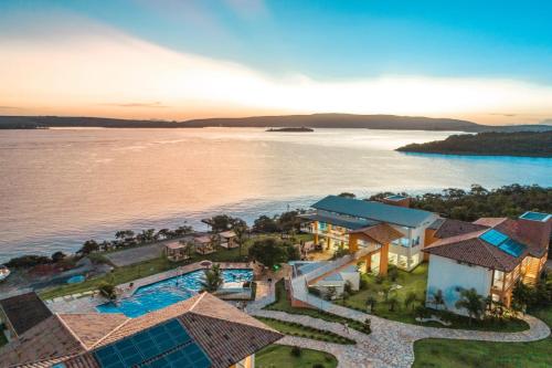 an aerial view of a resort next to a body of water at Riviera Capitólio Hotel in Capitólio