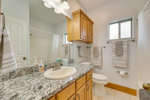 a bathroom with a sink and a toilet at Laguna Vista Vacation Rental with Pool Access! in Laguna Vista