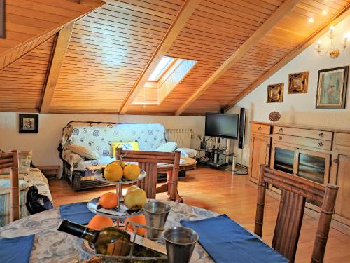 a living room with a couch and a table at Attic Old Town Apartment in Budva