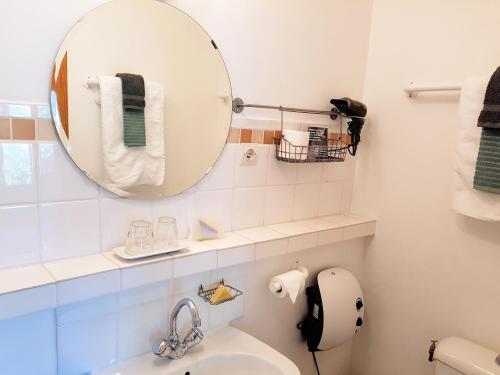 a bathroom with a mirror and a sink at Private room with stunning view Gorges du Verdon in Castellane