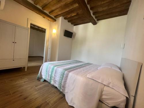 Katil atau katil-katil dalam bilik di Casa Aldobrandeschi Saturnia