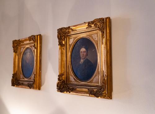 two framed portraits of a man on a wall at Hotel Seehof Norderney OHG in Norderney