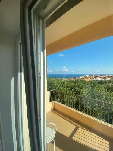 a balcony with a view of the ocean at Hotel America in Marina di Camerota