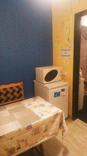 a hospital room with a bed and a microwave at Apartment in Izyum Rizdvyana 9 in Izyum