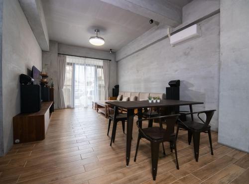 a dining room with a table and chairs at 48-6 Homestay in Xincheng