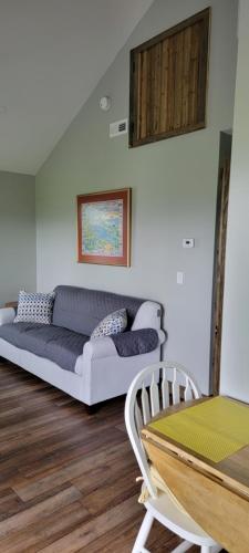 a living room with a couch and a table at Grand View Resort in Weirs Beach