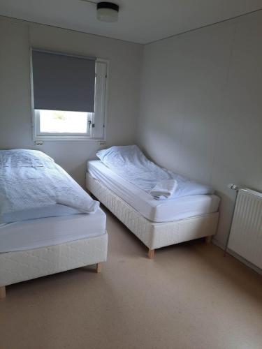 Katil atau katil-katil dalam bilik di Vinland Apartment 1