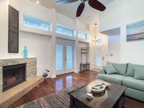 a living room with a couch and a fireplace at Perdido-Orange Beach, Golfing 2BR-2,5BT in Pensacola