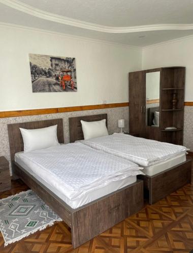 a bedroom with a large bed in a room at Grigoleti River Club in Maltakva