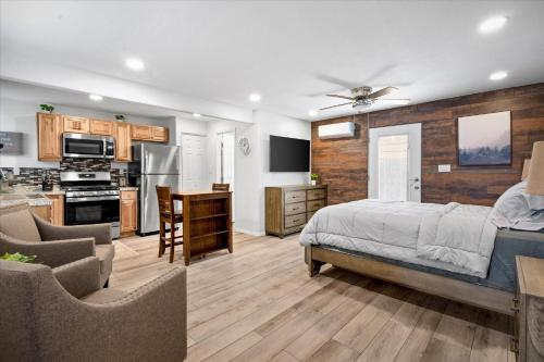a large bedroom with a bed and a kitchen at 11 Chelsea Place condo in Phoenix