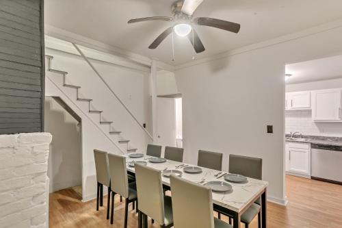 a dining room with a table and a ceiling fan at Cozy charming two-story home great for long stays home in Savannah