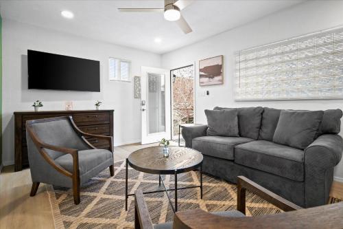 a living room with a couch and a tv at 23 Chelsea Place condo in Phoenix