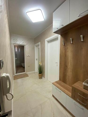 a large bathroom with a sink and a ceiling at Apartment Veronika in Sozopol
