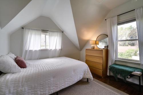 a bedroom with a white bed and a window at Pet-Friendly Saint Paul Home - Near Allianz Field! in Saint Paul