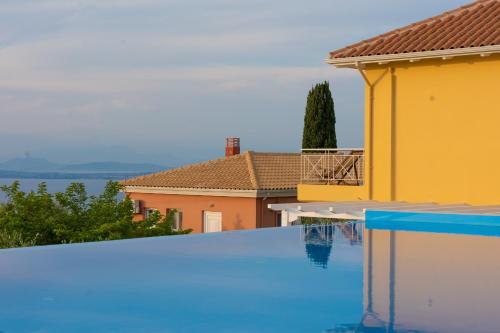 a swimming pool in a villa with a view at Villa Erato in Tsoukalades