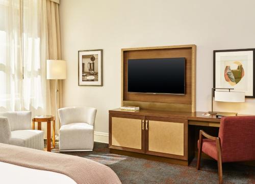 a hotel room with a television and a bed at Palace Hotel, a Luxury Collection Hotel, San Francisco in San Francisco
