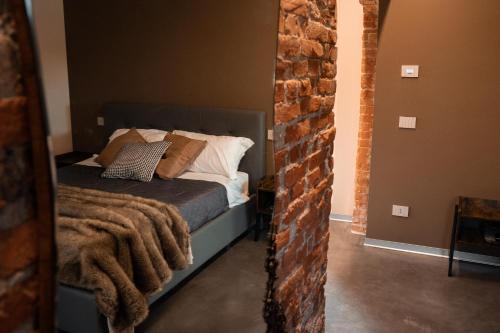 a bedroom with a bed with a blanket on it at Bed & Breakfast Gioia di... in Santo Stino di Livenza