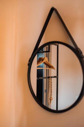 a close up of a mirror hanging on a wall at Bed & Breakfast Gioia di... in Santo Stino di Livenza
