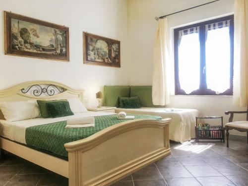 a bedroom with a bed and a window at Villa Panoramica sul Mare in Valderice