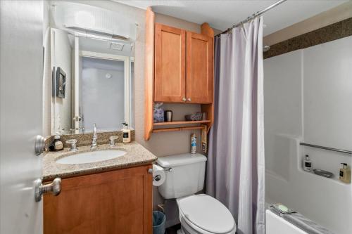 a bathroom with a toilet and a sink and a shower at 100 Bell Rock Condo- Supai condo in Sedona