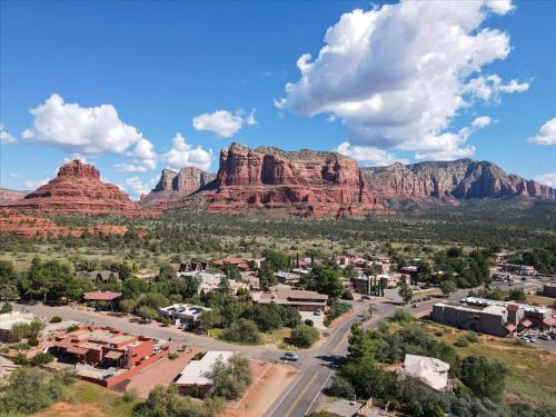 an aerial view of a small town in front of red rocks at 100 Bell Rock Condo- Supai condo in Sedona