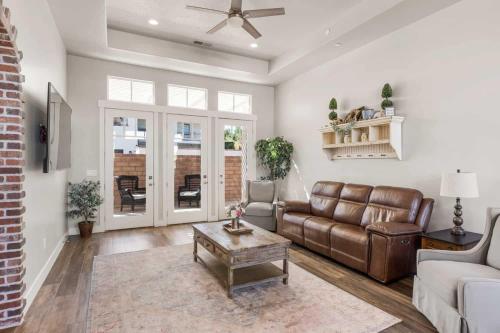 a living room with a couch and a coffee table at The Ella home in Hurricane