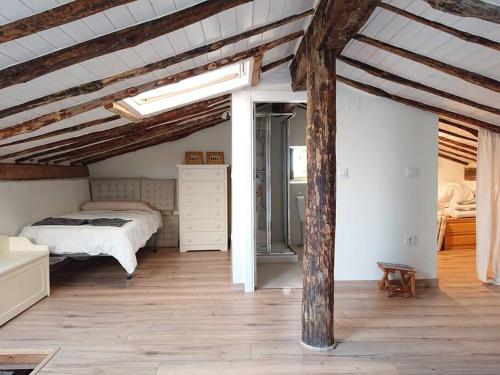 En eller flere senge i et værelse på Casa Pozo Tarama