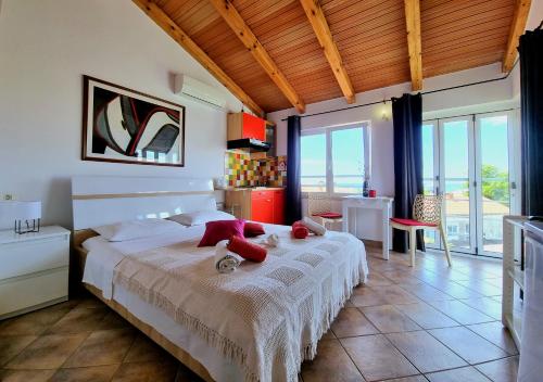 a bedroom with a bed with two stuffed animals on it at Apartments Zonta 800 m From Beach in Rovinj