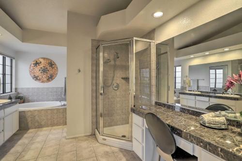 a bathroom with a shower and a sink and a tub at Luxury Living in La Quinta Home with Heated Pool! in La Quinta