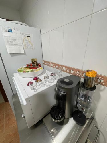 a kitchen with a coffee maker and a bowl of food at Work and Rest Away From Home in Paterna