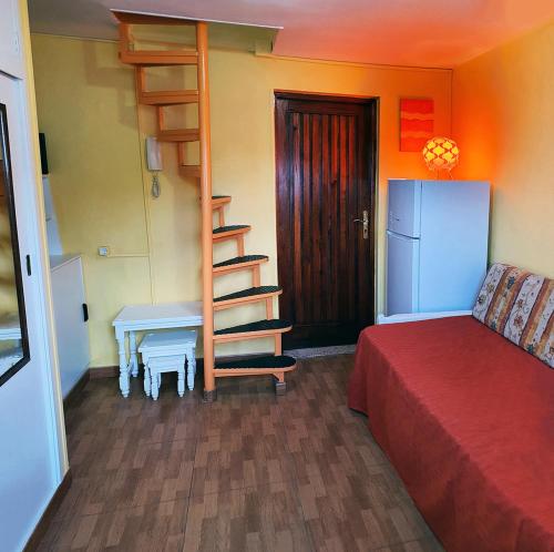 Una cama o camas en una habitación de Acogedor duplex en el centro de Santa Cruz