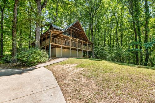 a large house in the woods with a driveway at Smokies Sanctuary in Hatchertown