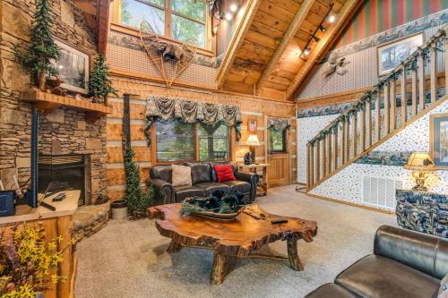 a living room filled with furniture and a fireplace at Smokies Sanctuary in Hatchertown