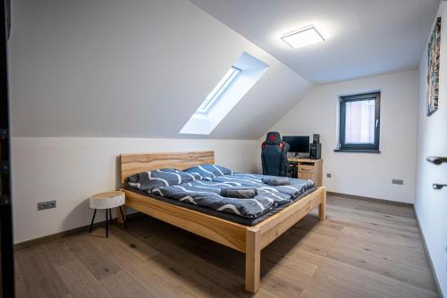 Postel nebo postele na pokoji v ubytování Apartmány v Podzámčí