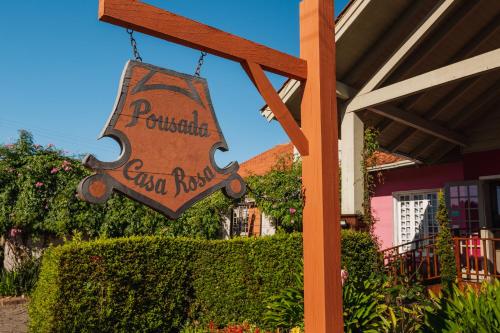 a sign for a restaurant that says pendleton inn rock at Pousada Casa Rosa in Canela