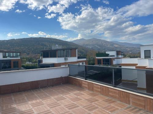 a balcony with a view of the mountains at Emela Villa in Sapanca