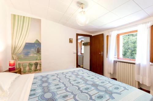 a bedroom with a large bed in a room at Casina Orione in Montecatini Val di Cecina