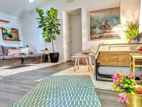 a living room with a piano and a couch at RARE Downtown Matthews walk 2 shops restauraunts hike CLT 2 Bedroom not 3br in Charlotte